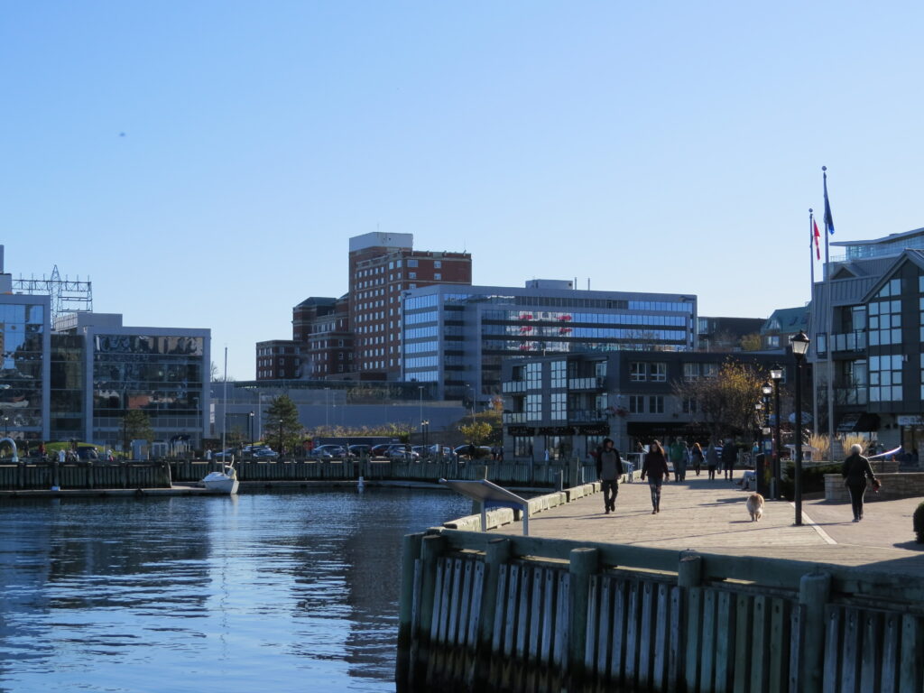 Halifax harbour boardwalk and water with the city skyline in the background.