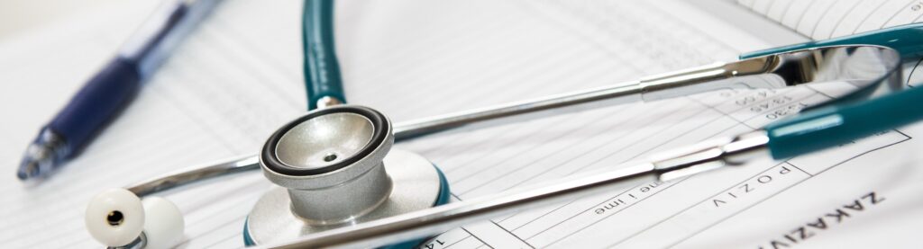 A stethoscope on a desk