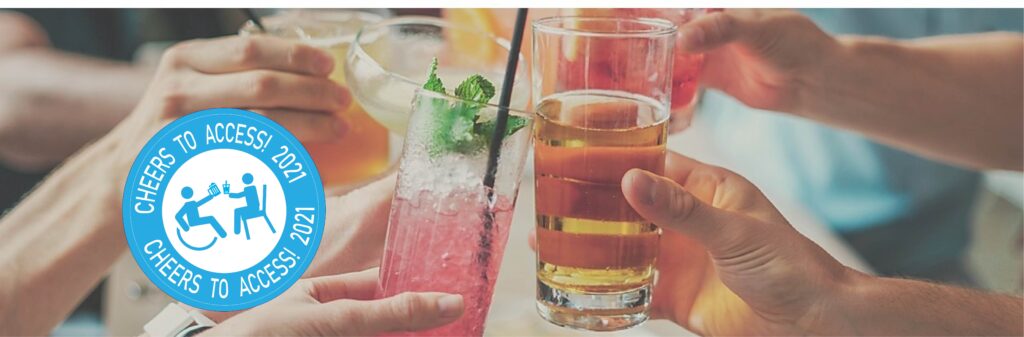 A close-up image of hands raising glasses into a cheers.